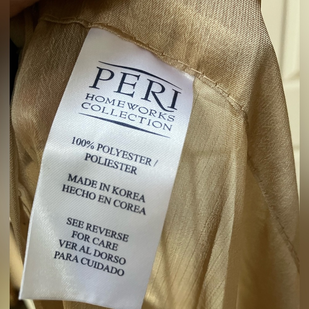 One pair long taupe/tan sheer drapery. 86”long. Ea half is 42” wide, x2=84”wide.